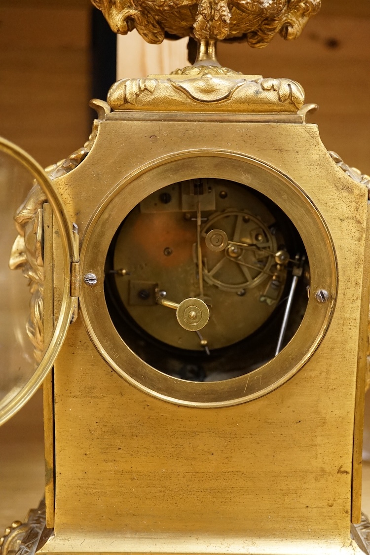 A 19th century French ormolu mantel clock with email dial and hand painted panels, with pendulum, no key, 39cm high